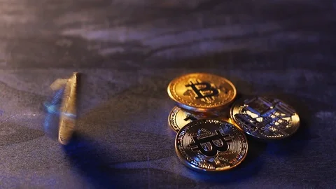 Bitcoin coin spinning on a dark table Stock Footage 101514533