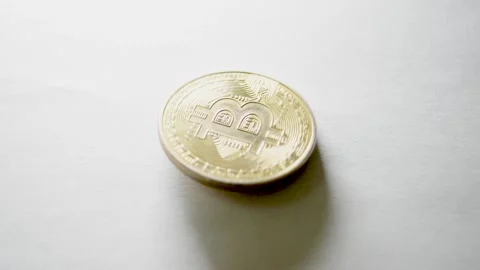 Bitcoin coin spinning on surface Stock Footage 315013079