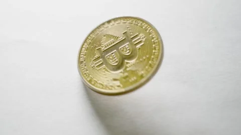 Bitcoin coin spinning on surface Stock Footage 315013083