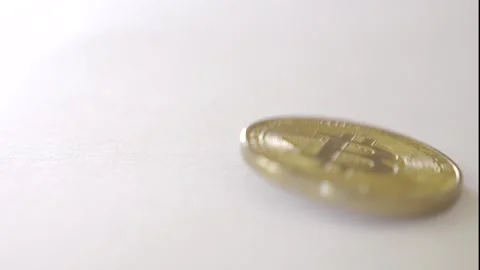 Bitcoin coin spinning on surface Stock Footage 315013084