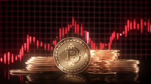 Bitcoin Coin Stacks Against Declining Graph Stock Footage 274178381