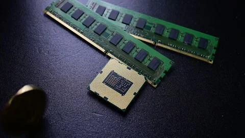 Bitcoin coins appearing beside computer processor and memory technology concept Stock Footage 331124106