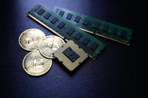 Bitcoin coins with computer hardware representing digital finance technology 库存照片