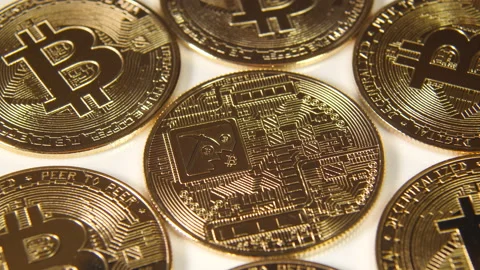 Bitcoin coins with illustration of mining. Close up. Stock Footage 154538074