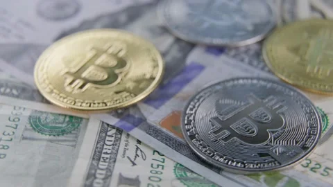 Bitcoin coins lie on dollars Stock Footage 171137775