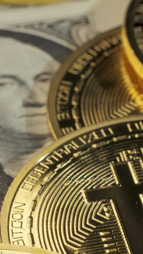 Bitcoin coins on US dollar banknote close-up cryptocurrency finance Stock Footage 346119134