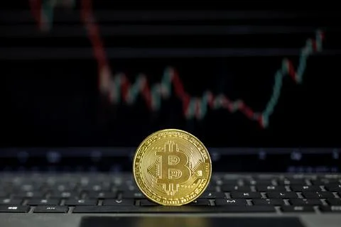 Bitcoin on computer with graph on background, Bit coin cryptocurrency banking Stock Photos