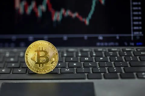 Bitcoin on computer with graph on background, Bit coin cryptocurrency banking Stock Photos