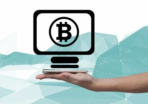 Bitcoin computer icon and hand holding phone Stock Photos