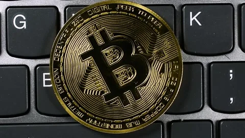 Bitcoin on Computer Keyboard Close Up Stock Footage 335990777