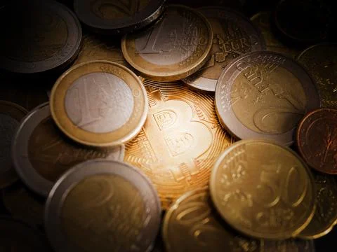 Bitcoin Concept Image with coin on the table with euro coins in the backgroun Foto stock