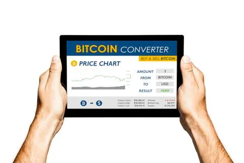 Bitcoin converter website in a tablet screen. Hands holding tablet on white. Stock Photos
