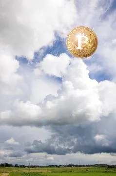 Bitcoin covered by clouds Stock Photos