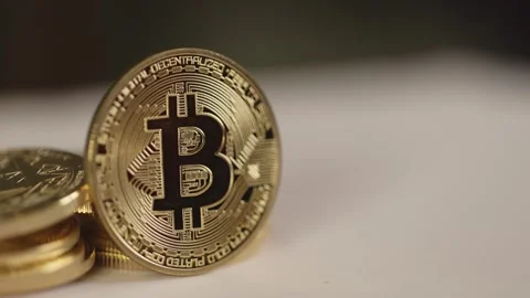 Bitcoin, created by Satoshi Nakamoto, decentralized digital currency Stock Footage 296230233