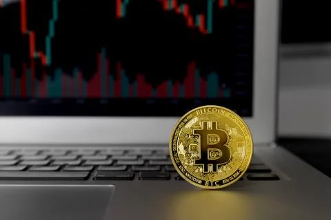 Bitcoin crypto currency located on notebook computer Stock Photos