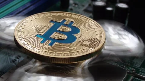 Bitcoin Crypto Currency, rotating mirror surface, computer motherboard. Stock Footage 87871913