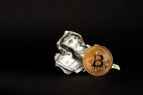 Bitcoin cryptocurrency against the dollar on black background. Battered dollar Stock Photos