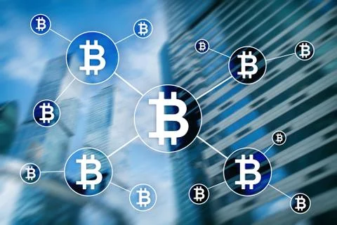 Bitcoin cryptocurrency and blockchain technology concept on blurred skyscrape Stock Photos