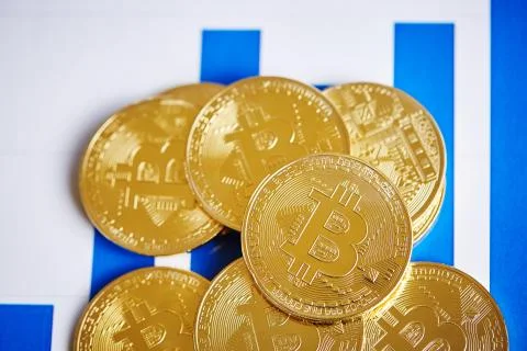 Bitcoin cryptocurrency on the chart background, close-up, shallow depth of field Stock Photos