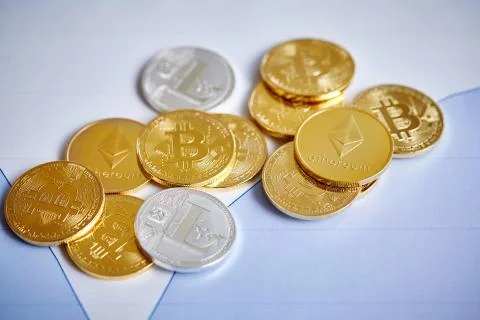 Bitcoin cryptocurrency on the chart background, close-up, shallow depth of field Stock Photos