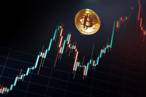 Bitcoin cryptocurrency coin on the background of the chart Stock Photos