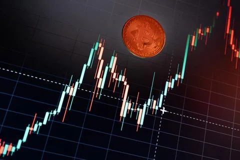 Bitcoin cryptocurrency coin on the background of the chart Stock Photos