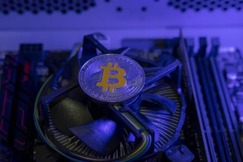 Bitcoin cryptocurrency coin on the computer. Cryptocurrency mining concept Stock Photos