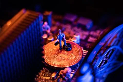 Bitcoin Cryptocurrency coin on a PC computer motherboard, crypto currency min Stock Photos