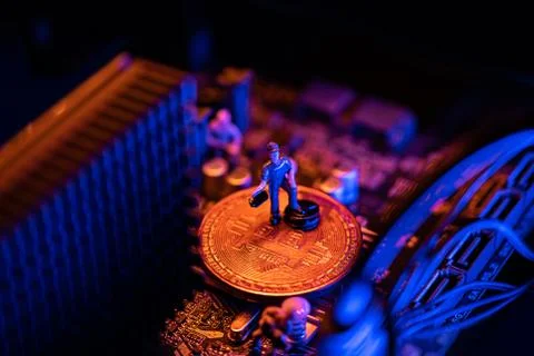 Bitcoin Cryptocurrency coin on a PC computer motherboard, crypto currency min Stockfoto's