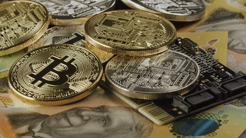 Bitcoin Cryptocurrency on a computer chip with Australian dollars below. cryptog Stock Footage 122336052