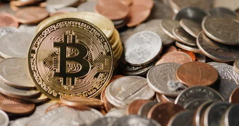 Bitcoin cryptocurrency concept shot, stack of bitcoin among assorted US Stock Footage 244190037