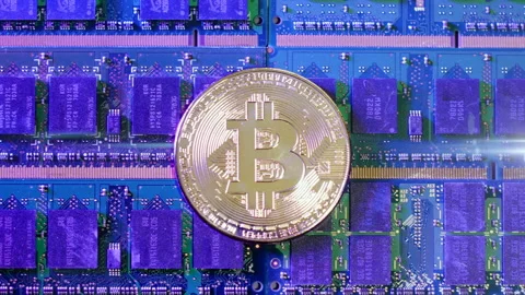 Bitcoin cryptocurrency with electric passing through on microchip board Stock Footage 160985711