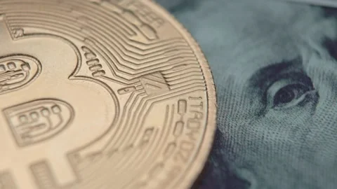 Bitcoin, a cryptocurrency equivalent to a dollar, a hundred dollars. Stock Footage 151111065