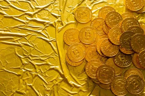 The Bitcoin cryptocurrency in gold texture  image background. Stock Photos