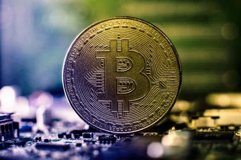 Bitcoin cryptocurrency new version on computer electronic circuit board backg Stock Photos