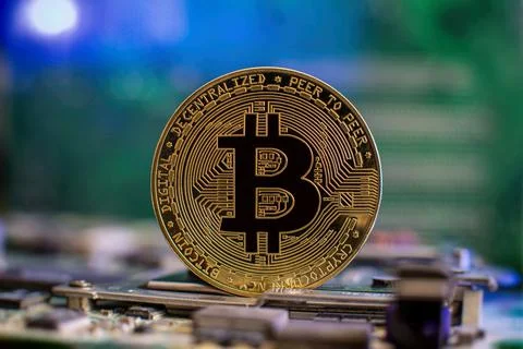 Bitcoin cryptocurrency new version on computer electronic circuit board backg Stock Photos
