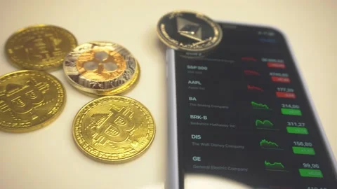 Bitcoin cryptocurrency price chart on digital exchange on mobile phone screen Stock Footage 169843162