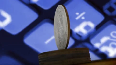Bitcoin cryptocurrency rotating with market numbers data in background Stock Footage 165276205