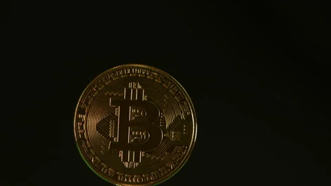 Bitcoin cryptocurrency spinning on black background pt 4 of 12 Stock Footage 149707984