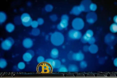 Bitcoin currency on keyboard computer on bokee background.Virtual cryptocurre Stock Photos
