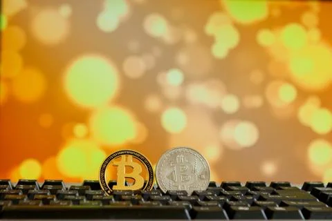 Bitcoin currency on keyboard computer on bokee background.Virtual cryptocurre Stock Photos
