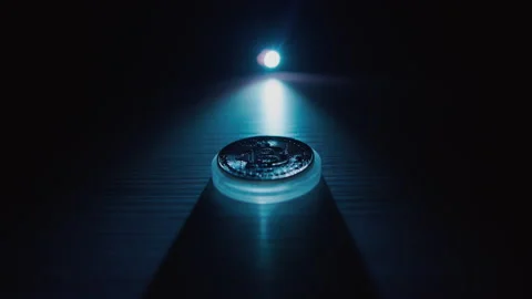 Bitcoin on a dark background is illuminated with a contrasting light Stock Footage 168468903
