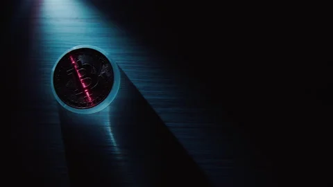 Bitcoin on a dark background is illuminated with a contrasting light and scanned Stock-Footage 168469203