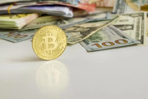 Bitcoin with dolar banknotes Stock Photos
