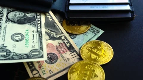 Bitcoin with dollars bills in wallet. Digital crypto coin. Investments, investor Видео 329410843