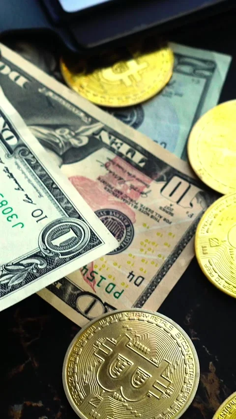 Bitcoin with dollars bills in wallet. Digital crypto coin. Investments, investor Видео 329410881