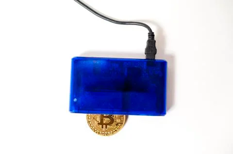 Bitcoin electronic coin inside a digital card reader, white background Foto stock