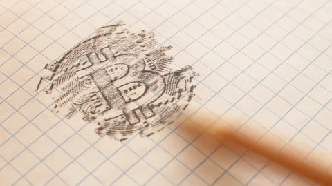 Bitcoin engraving on a notebook sheet with a pencil, hatching appears on the lin Stock Footage 101666017