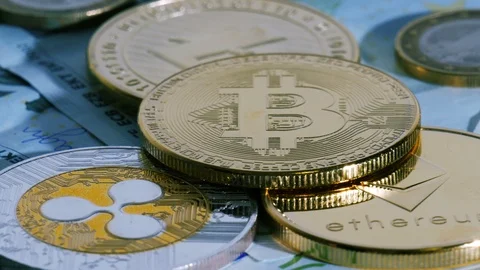 Bitcoin Ether Litecoin Ripple. Cryptocurrencys loopable rotation shot. Stock Footage 86488525