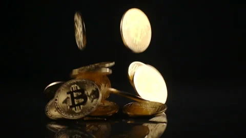 Bitcoin falls on a black surface Stock Footage 85470645